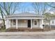 Charming craftsman style home with a front porch and well-maintained landscaping at 4 Magnolia St, Porterdale, GA 30014