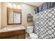 Clean bathroom with granite countertop and geometric curtain at 25 Grange Ct, Sharpsburg, GA 30277