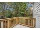 Small wooden deck overlooking a wooded backyard at 125 Village Pkwy, Woodstock, GA 30188