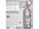 Laundry room with a new water heater and overhead cabinets at 731 Victoria Sw Pl, Atlanta, GA 30310