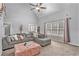 Spacious living room with sectional sofa and large window at 2213 Jessowen Se Way, Conyers, GA 30013