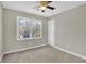 Bright bedroom with double window, ceiling fan, and neutral walls at 4810 Winding Ln, Powder Springs, GA 30127