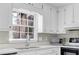 Kitchen with white cabinets, sink, and microwave at 4810 Winding Ln, Powder Springs, GA 30127