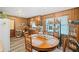 Kitchen with wood cabinets, oval dining table, and built-in shelving at 181 Edwards St, Canton, GA 30114