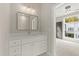 White bathroom vanity with a modern mirror at 2333 Mason Dr # D26, Atlanta, GA 30316