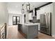 Modern kitchen with gray island, white cabinets, and stainless steel appliances at 2333 Mason Dr # D26, Atlanta, GA 30316