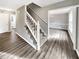 Staircase with white railings leading to upper level at 978 Gwens Sw Trl, Lilburn, GA 30047