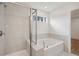 Elegant bathroom with soaking tub and walk in shower at 1612 Tide Mill Rd, Cumming, GA 30040