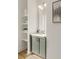 Small bathroom with gray vanity, white subway tile, and built-in shelving at 1237 Memorial Se Dr # 401, Atlanta, GA 30316