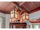 Detailed close-up of a unique wooden chandelier with frosted glass panels at 788 S Hwy 11 S, Social Circle, GA 30025