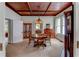 Elegant dining room with hardwood floors, wood ceiling, and antique furniture at 788 S Hwy 11 S, Social Circle, GA 30025