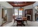 Formal dining room with a round table, hardwood floors and a fireplace at 788 S Hwy 11 S, Social Circle, GA 30025