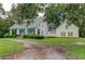 Charming white farmhouse with large wrap-around porch and detached building at 788 S Hwy 11 S, Social Circle, GA 30025