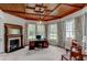 Spacious home office featuring hardwood floors, built-in shelving, and a fireplace at 788 S Hwy 11 S, Social Circle, GA 30025