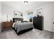 Serene bedroom with gray bedding and a black dresser at 528 Lanier Way, Temple, GA 30179