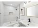 Updated bathroom, featuring a bathtub, shower, and modern vanity at 1288 Almont Sw Dr, Atlanta, GA 30310