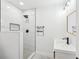 Modern bathroom with a walk-in shower and floating vanity at 1288 Almont Sw Dr, Atlanta, GA 30310