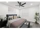 Well-lit bedroom featuring a king-size bed and a ceiling fan at 1288 Almont Sw Dr, Atlanta, GA 30310