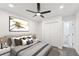 Spacious bedroom with a queen-size bed and double doors to closet at 1288 Almont Sw Dr, Atlanta, GA 30310
