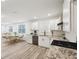 Modern kitchen with white cabinets and granite counters at 1288 Almont Sw Dr, Atlanta, GA 30310
