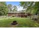 Large backyard with fire pit at 1051 Rock Springs Rd, Lawrenceville, GA 30043