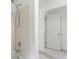 Bathroom with shower, tile, and mirrored vanity at 1051 Rock Springs Rd, Lawrenceville, GA 30043