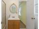 Small bathroom with vanity, mirror and access to bedroom at 1051 Rock Springs Rd, Lawrenceville, GA 30043