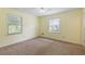 Bright bedroom with two windows and neutral carpet at 1051 Rock Springs Rd, Lawrenceville, GA 30043