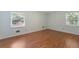 Spacious bedroom featuring light walls and wood flooring at 1051 Rock Springs Rd, Lawrenceville, GA 30043