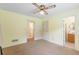 Bedroom with ceiling fan and access to bathroom and closet at 1051 Rock Springs Rd, Lawrenceville, GA 30043