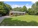 Brick house with a green lawn and driveway at 1051 Rock Springs Rd, Lawrenceville, GA 30043
