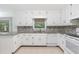 Kitchen with granite countertops and white cabinets at 1051 Rock Springs Rd, Lawrenceville, GA 30043
