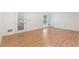 Hardwood floor living room with access to the backyard at 1051 Rock Springs Rd, Lawrenceville, GA 30043