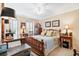 Bright bedroom featuring a wooden bed frame and ample space at 3488 Tulip Tree Ln, Duluth, GA 30096