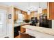 Well-equipped kitchen featuring granite countertops and wood cabinets at 3488 Tulip Tree Ln, Duluth, GA 30096