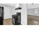 Black range and refrigerator in the kitchen at 5854 Bobbin Ln, Lithonia, GA 30058