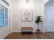 Light and airy entryway with hardwood floors, a wooden bench, and wall art at 308 Tree Top Ln, Canton, GA 30114