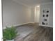 Neutral-toned living room features wood-look floors and built-in shelving at 3777 Peachtree Ne Rd # 1021, Atlanta, GA 30319