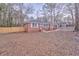 Brick ranch house with a large backyard and wooden fence at 3150 Humphries Se Dr, Atlanta, GA 30354