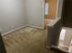 Spacious bedroom with neutral walls, carpet, and access to another room at 837 Crestwell Sw Cir, Atlanta, GA 30331
