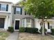 Two-story townhome with gray siding, black shutters, and landscaping at 837 Crestwell Sw Cir, Atlanta, GA 30331