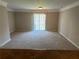 Large living room with carpet and sliding glass doors to a patio at 837 Crestwell Sw Cir, Atlanta, GA 30331