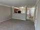 Spacious living room with carpeting, neutral walls, and an open floor plan at 837 Crestwell Sw Cir, Atlanta, GA 30331