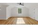 Bright bedroom with hardwood floors, ceiling fan and window at 514 Dogwood Cir, Norcross, GA 30071