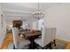 Dining room with a rustic wood table and chandelier at 514 Dogwood Cir, Norcross, GA 30071