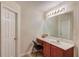 Clean bathroom with a vanity, sink, and large mirror at 6273 Lake Valley Pt, Lithonia, GA 30058