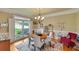 Bright dining room with hardwood floors and large windows at 3014 Oaktree Ne Ct, Marietta, GA 30066