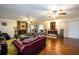 Living room with hardwood floors and a fireplace at 3241 Briscoe Rd, Loganville, GA 30052