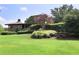 Community clubhouse with scenic green space and landscaping at 68 Montre Nw Sq, Atlanta, GA 30327