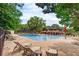 Relaxing community pool with surrounding lounge area at 68 Montre Nw Sq, Atlanta, GA 30327